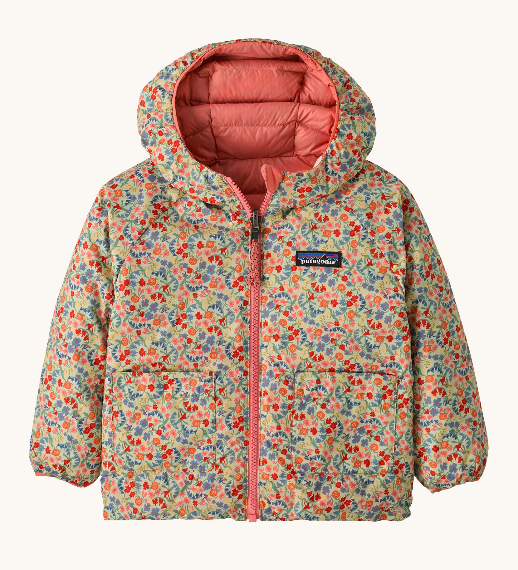 Patagonia little kids down hooded jacket in tiny world/lichen green. A light warm reversible jacket in pale green a cute floral design. Features a a full length zip and 2 side pouch pockets