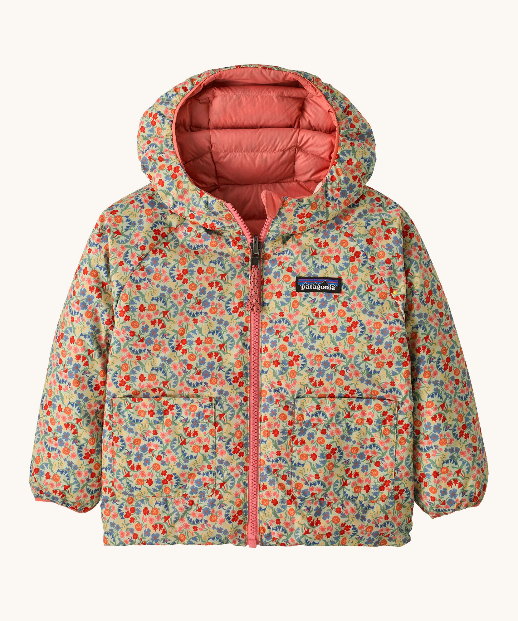Patagonia little kids down hooded jacket in tiny world/lichen green. A light warm reversible jacket in pale green a cute floral design. Features a a full length zip and 2 side pouch pockets