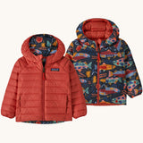 Patagonia Kids Reversible Down Hoody in salon energy/ink black design side by side showing the different colour and print detail.