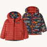 Patagonia Kids Reversible Down Hoody in salon energy/ink black design side by side showing the different colour and print detail.