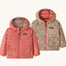 Patagonia Kids Reversible Down Hoody in tiny world/lichen green design side by side showing the different colour and print detail.
