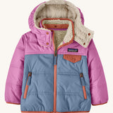 Patagonia little kids tribbles hoody available at Babipur. A reversible coat showing a blue and pink hooded coat and natural fleece inner for warmth. Features a small chest pocket with popper fastening and 2 side zip pockets