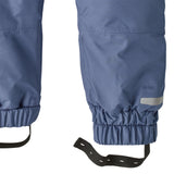A close up of the Patagonia Baby Snow Pile Bibs in a  brisk purple available at Babipur showing the foot strap open for size adjusting