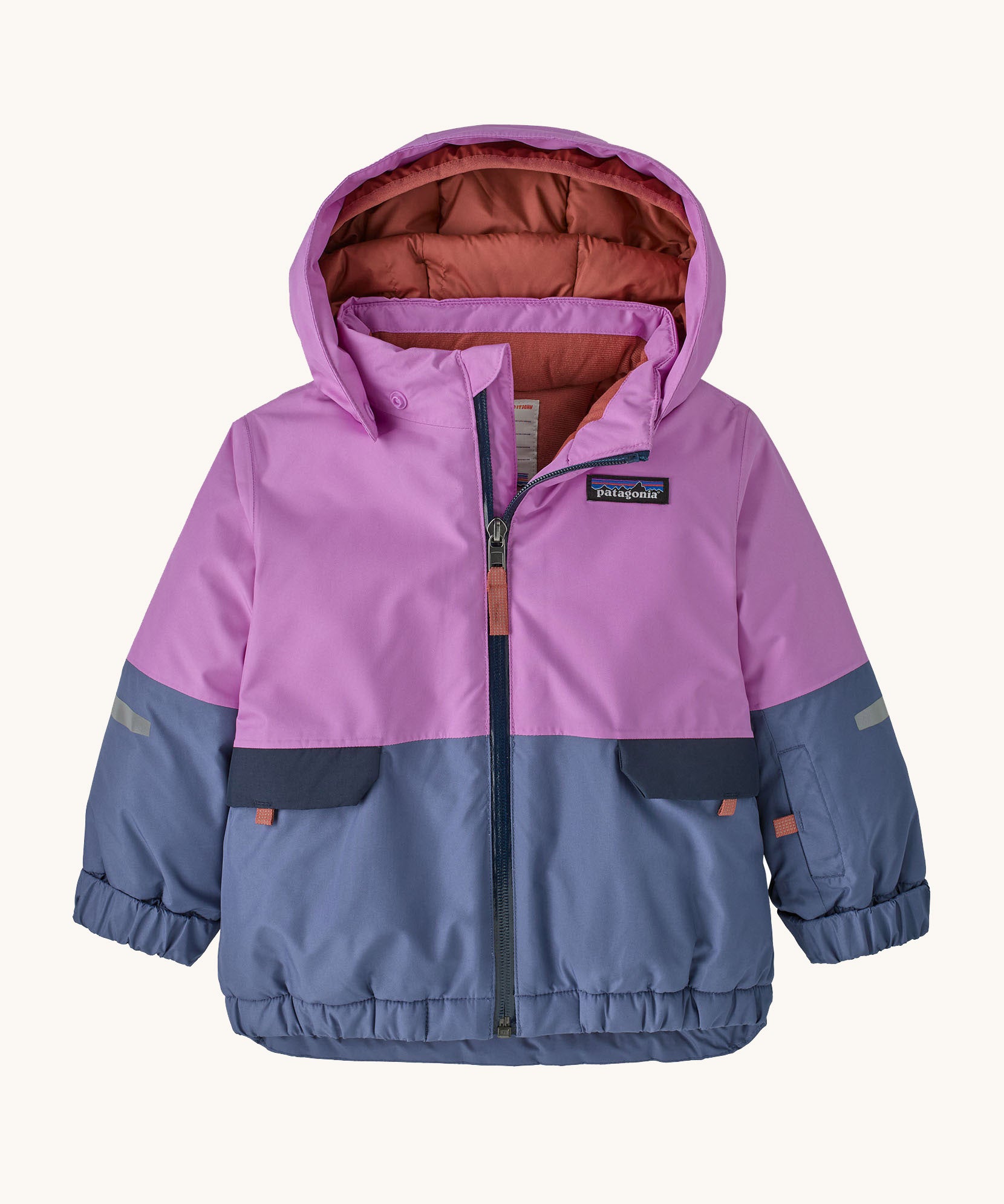 Patagonia little kids snow pile jacket in brisk purple available at Babipur. A 100% recycled polyester thick winter hooded jacket in bright purple and pale blue. Features a full length zip, side pocket and elasticated cuffs.