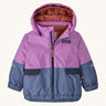 Patagonia little kids snow pile jacket in brisk purple available at Babipur. A 100% recycled polyester thick winter hooded jacket in bright purple and pale blue. Features a full length zip, side pocket and elasticated cuffs.