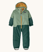 Patagonia little kids snow pile one piece in ellwood green available at Babipur. A 100% recycled polyester thick all in one suit in light and dark green. Features elasticated cuffs and band for a secure fit