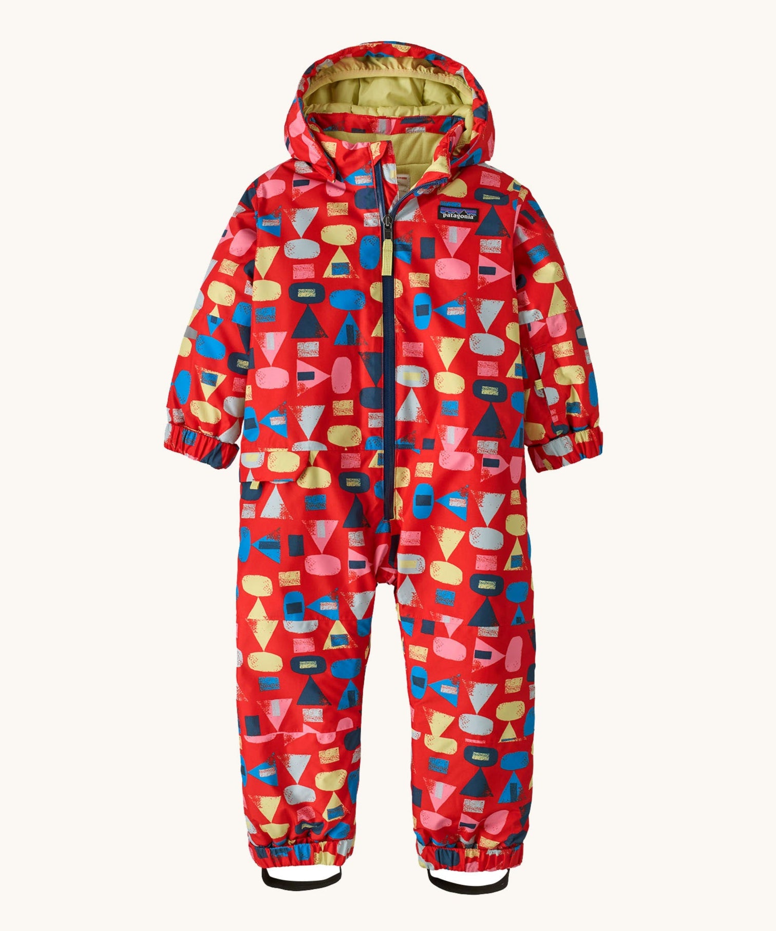 Patagonia little kids snow pile one piece in forest being/sizzle red available at Babipur. A 100% recycled polyester thick all in one suit in red with retro geometric shapes. Features elasticated cuffs and band for a secure fit