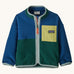 Patagonia little kids synchilla fleece in clement blue available at Babipur. A 100% recycled polyester soft fleece jacket in dark blue and green with pale blue trim. Features a full length zip and a yellow chest pocket
