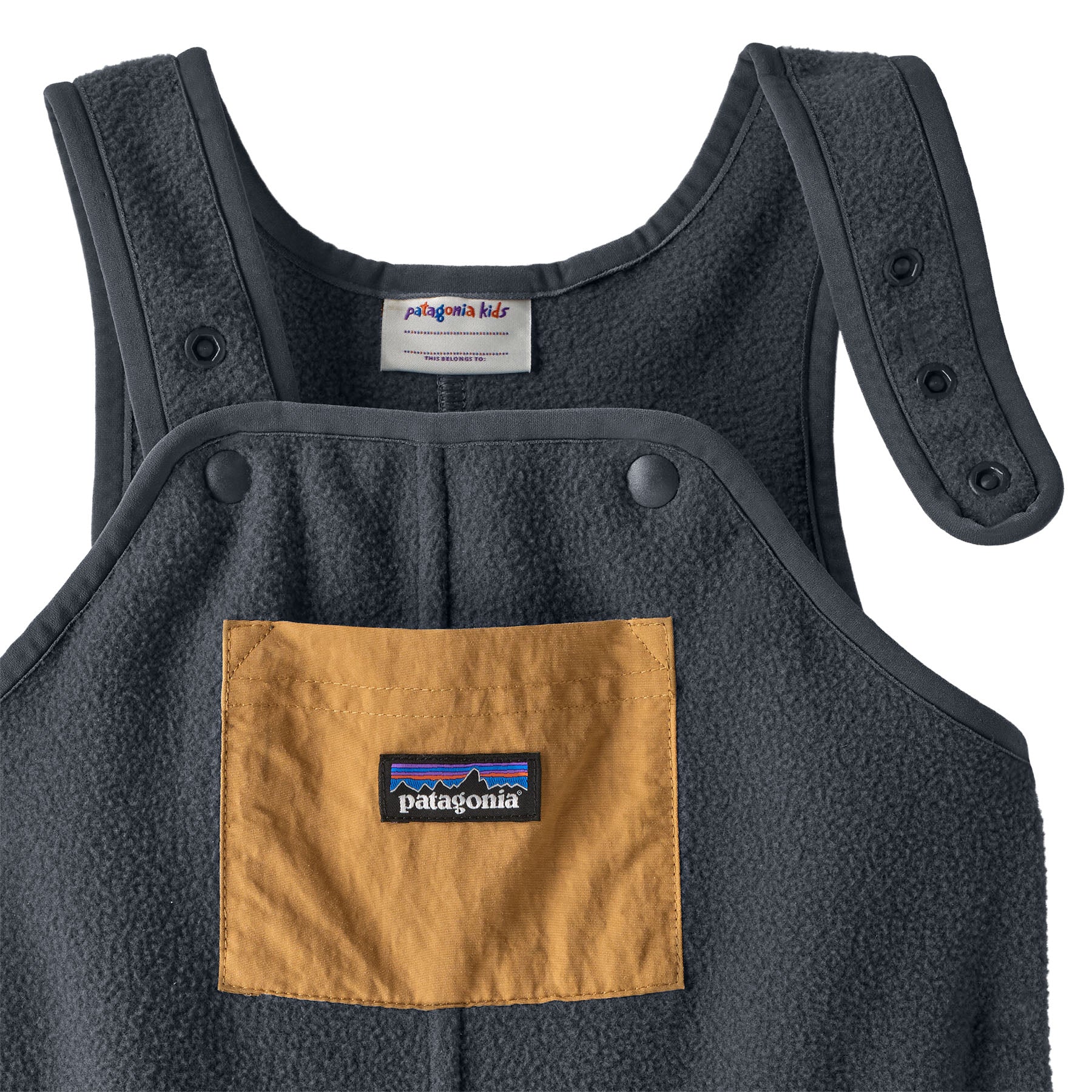Patagonia little kids synchilla fleece dungarees in smolder blue available at Babipur showing the popper detailing on the shoulder straps