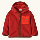 Patagonia little kids synchilla hoody in Amanita red. 100% recycled polyester hooded jacket in red with contrasting trim and pocket. Features a full length zip and a chest pocket. 