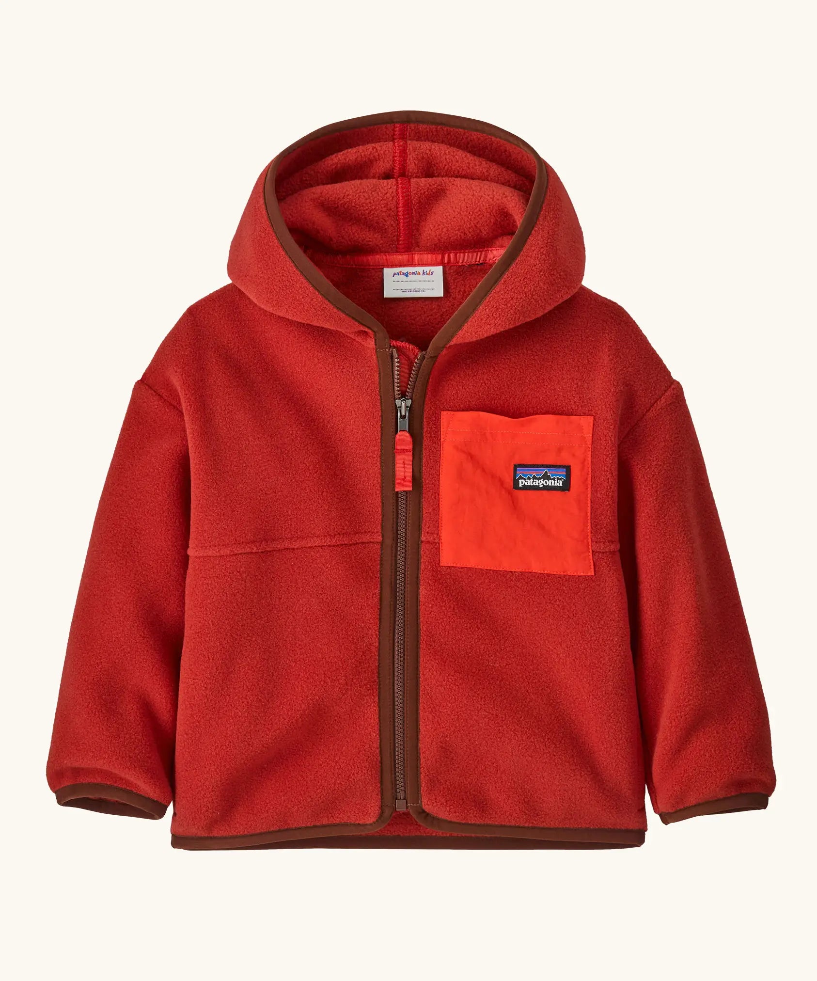 Patagonia little kids synchilla hoody in Amanita red. 100% recycled polyester hooded jacket in red with contrasting trim and pocket. Features a full length zip and a chest pocket. 