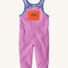 Patagonia little kids synchilla fleece dungarees in brisk purple available at Babipur. A 100% recycled polyester soft fleece dungarees in bright purple with blue trim. Features a small front pocket in orange, elasticated leg cuffs and popper fasteners on the shoulder straps