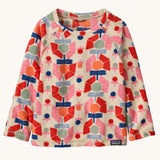 Patagonia kittle kids micro d crew jumper in stamped floral/natural available at Babipur. A 100% recycled polyester soft fleece jumper in cream with a retro multicoloured flower pattern design 