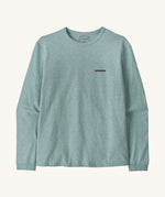 Patagonia women's outline responsibili top available at Babipur. A blue, long sleeve t-shirt showing the brand text printed on the chest