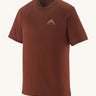 The Patagonia Men's Capilene Cool Merino Graphic Shirt in drift ways dried vanilla available at Babipur. A brown short sleeve top with a mountain graphic on the chest