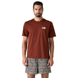 A man wearing the Patagonia Men's 73 Skyline Organic T-Shirt available at Babipur.