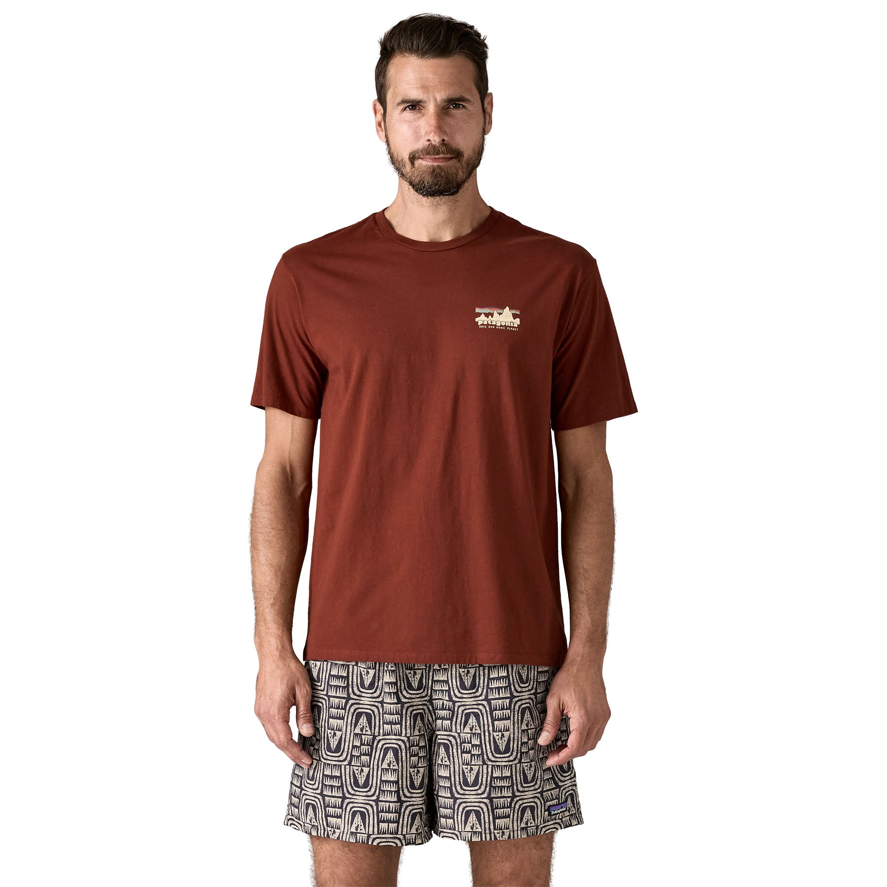 A man wearing the Patagonia Men's 73 Skyline Organic T-Shirt available at Babipur.