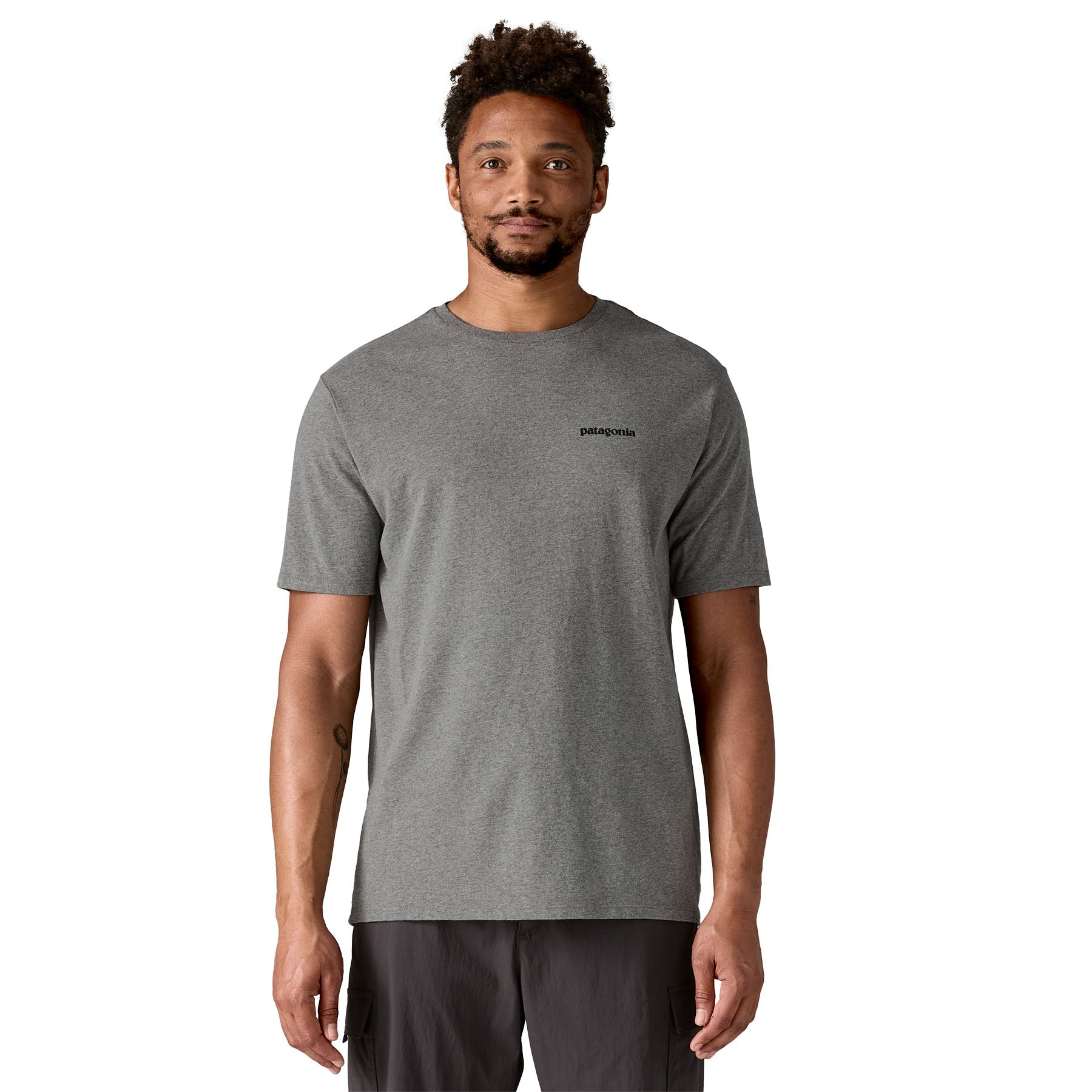 A man wearing the Patagonia men's fitz roy tee in gravel heather available at Babipur.