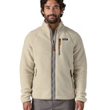 A man wearing the the Patagonia Men's Retro Pile Fleece Jacket in a Pelican colour available at Babipur.