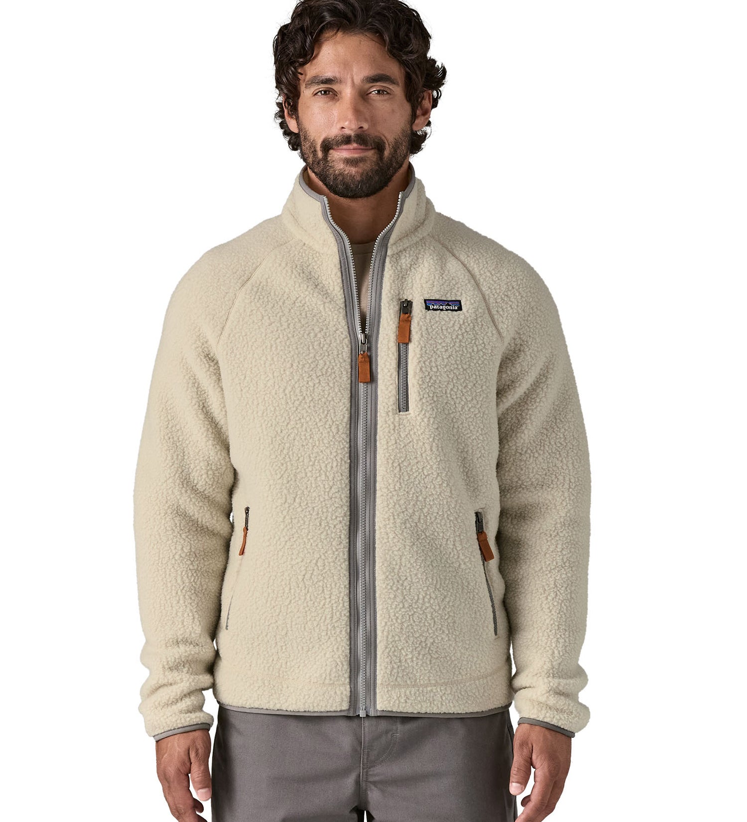 A man wearing the the Patagonia Men's Retro Pile Fleece Jacket in a Pelican colour available at Babipur.