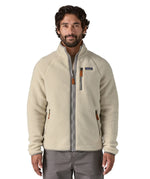 A man wearing the the Patagonia Men's Retro Pile Fleece Jacket in a Pelican colour available at Babipur.