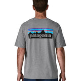 Man wearing Patagonia's men's responsibili t-shirt in grey with large logo patch on the upper back. T-shirt has a relaxed fit
