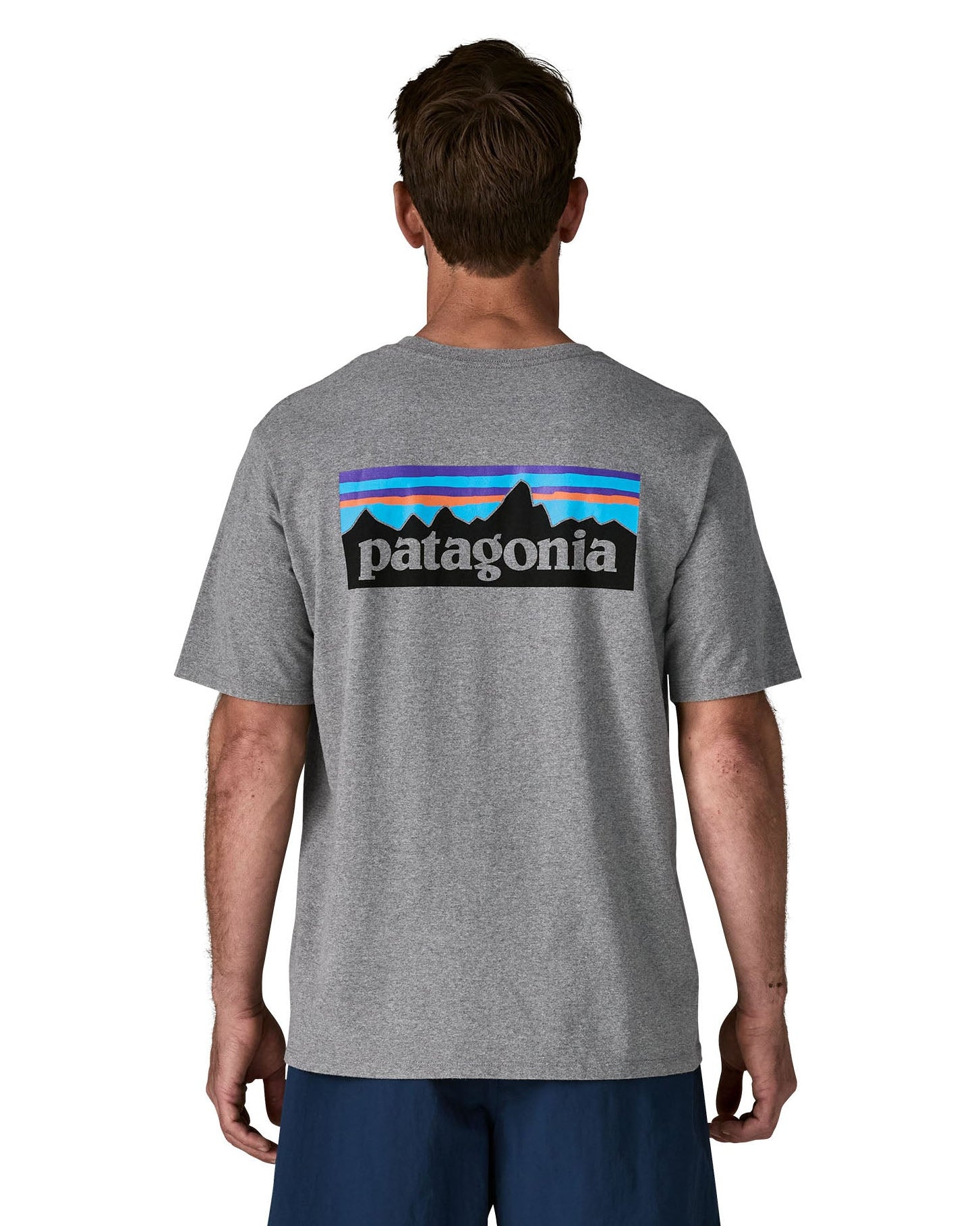 Man wearing Patagonia's men's responsibili t-shirt in grey with large logo patch on the upper back. T-shirt has a relaxed fit
