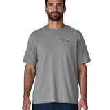 Man wearing Patagonia's men's responsibili t-shirt in grey with brand text on chest. T-shirt has a relaxed fit