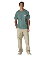 Man wearing Patagonia's 100% organic cotton 73 skyline t-shirt in pastel blue. T-shirt has relaxed fit 