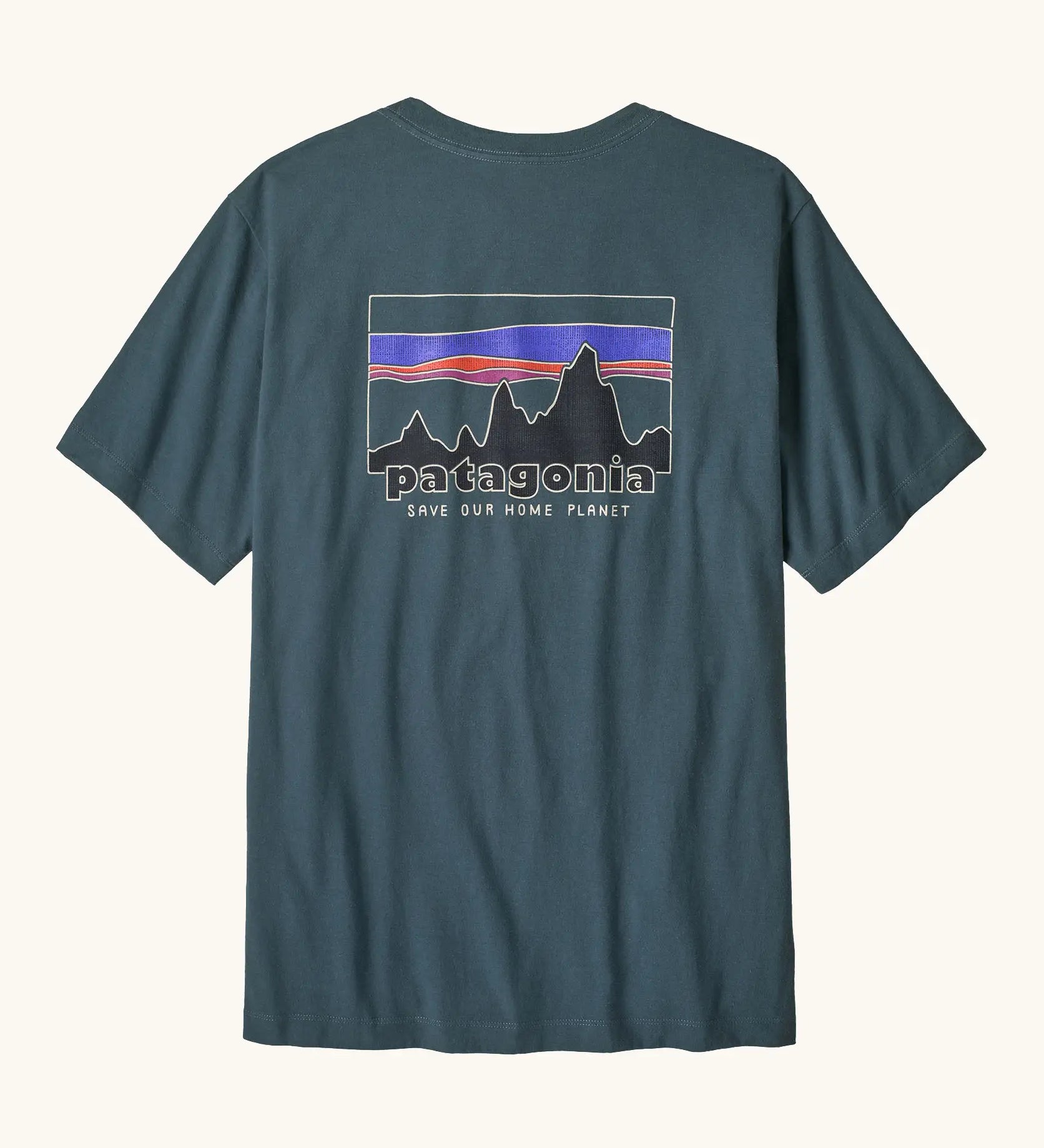 Patagonia men's 100% organic cotton 73 skyline t-shirt in dark blue with a mountain range logo on the upper back