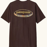 Patagonia men's 95 oval logo short sleeve t-shirt in den brown. Shows large oval brand patch on upper back