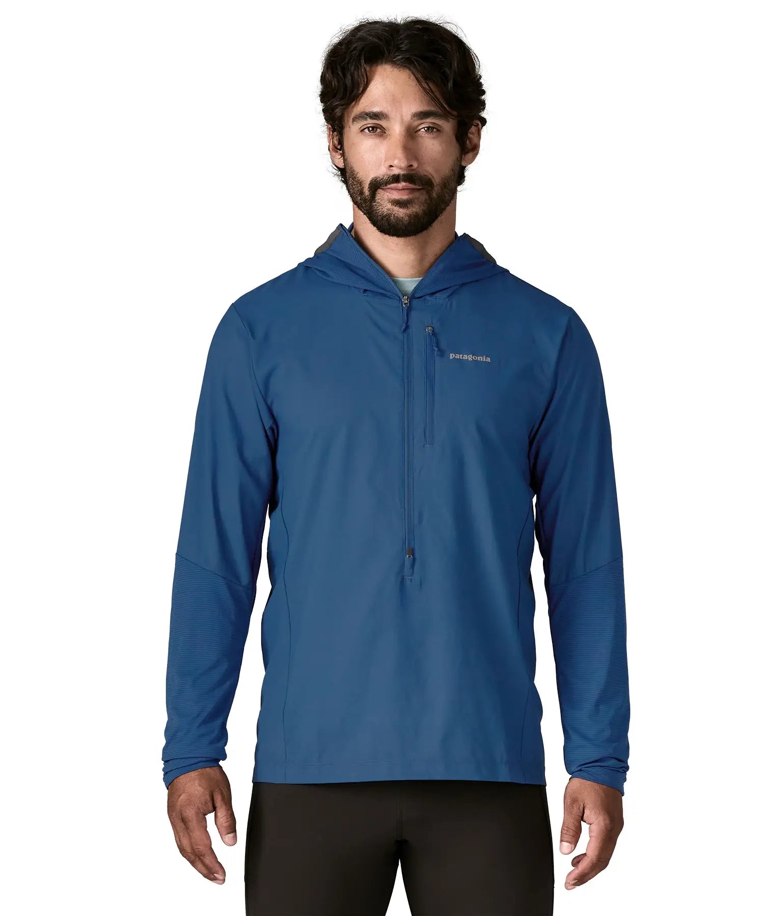 Man wearing Patagonia men's airshed pro pullover in blue. Top has a slim fit and sits around the hips