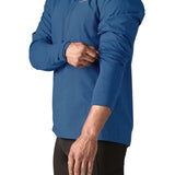 Patagonia men's airshed pro pullover in blue showing close up of the stretch fit sleeve