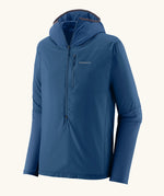 Patagonia men's airshed pro pullover in blue. Water repellent hooded top with 3/4 zip and chest pocket