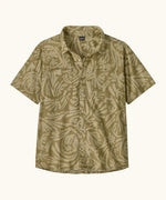Patagonia men's buttoned short sleeve shirt in light green with repeating abstract pattern design and chest pocket