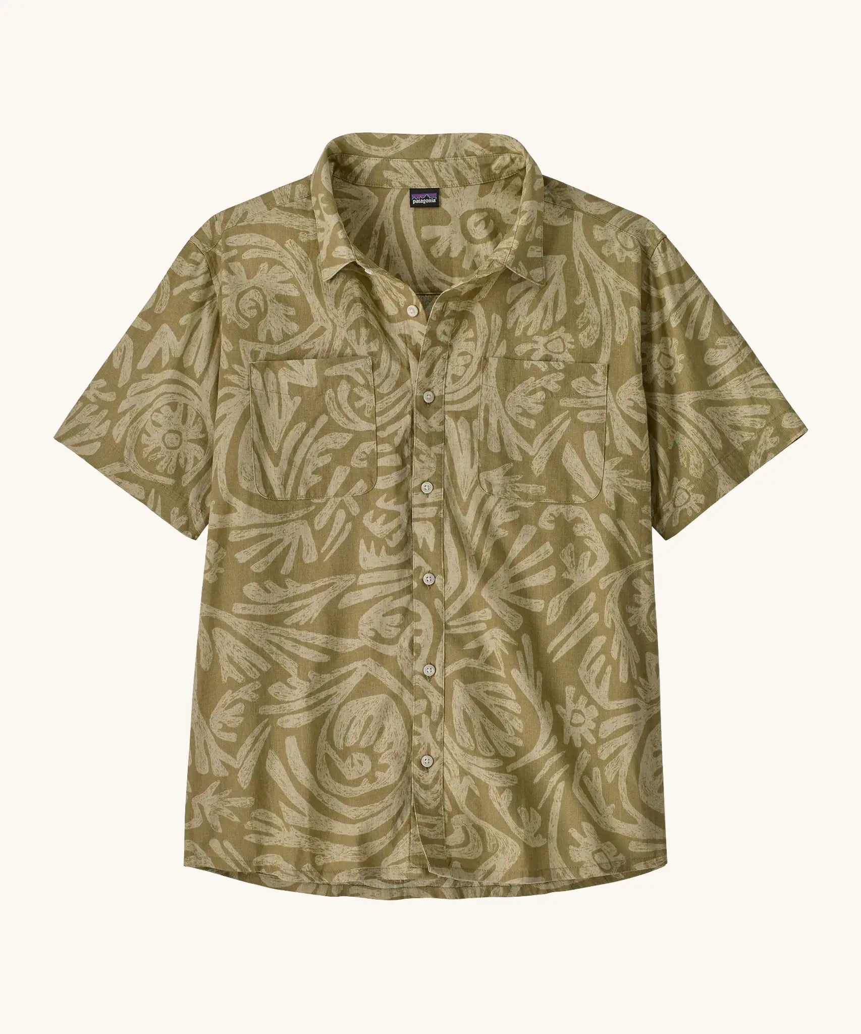 Patagonia men's buttoned short sleeve shirt in light green with repeating abstract pattern design and chest pocket