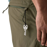 Keys tied onto loop on a zip of the back pocket on Patagonia men's quick drying 6 inch baggies shorts in dark green 