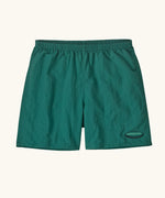 Patagonia quick drying men's baggies shorts in teal green. Shows 2 side pockets and oval logo on leg