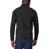 Back of man wearing Patagonia's better sweater in black. Jacket has a regular fit and sits around the hips