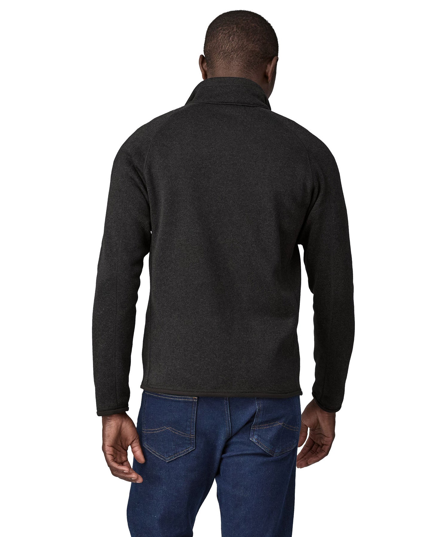 Back of man wearing Patagonia's better sweater in black. Jacket has a regular fit and sits around the hips