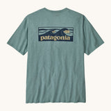 Patagonia men's boardshort responsibili tee in light blue. Shows a dark blue wave brand logo on the upper back