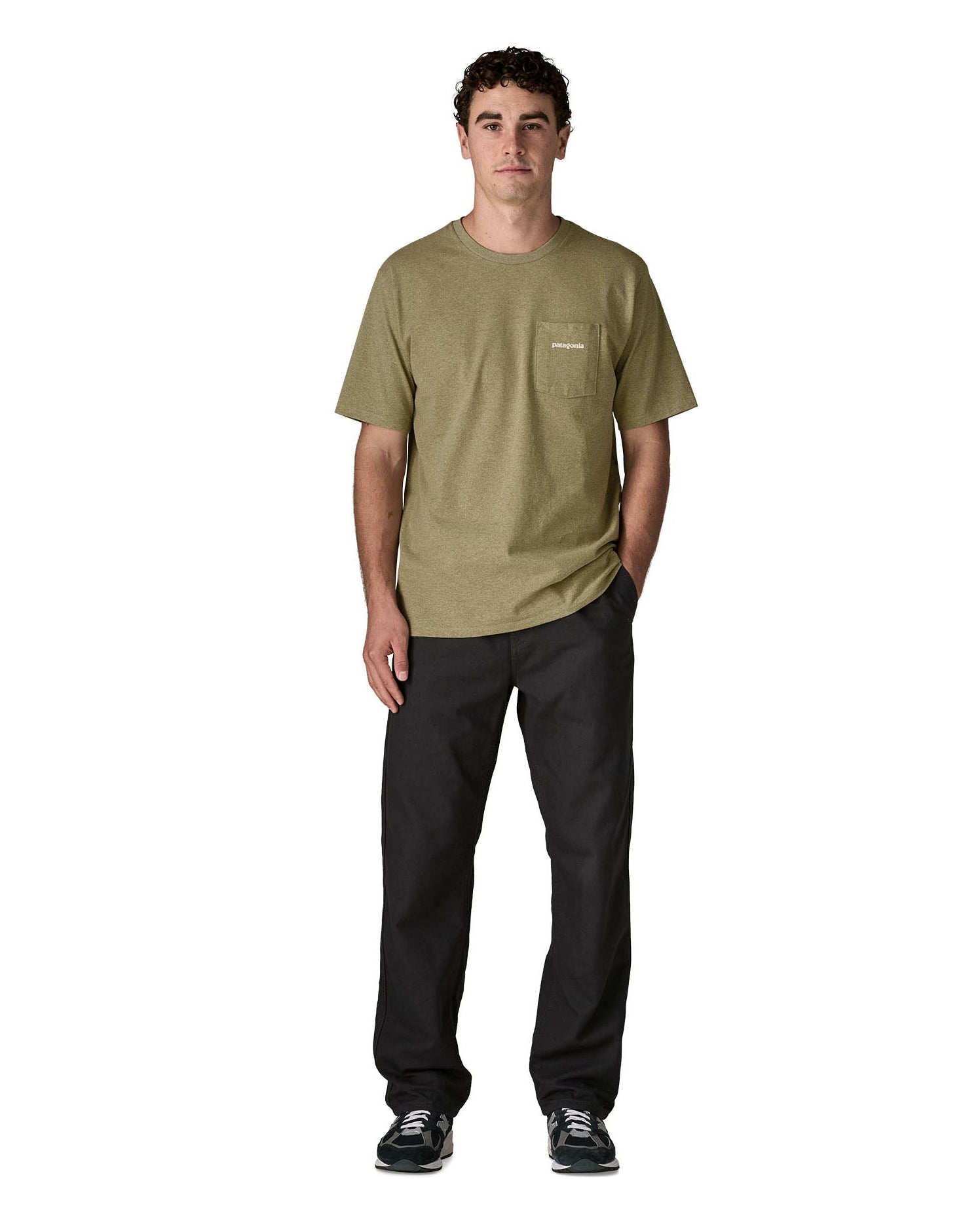 Man wearing Patagonia's men boardshort logo pocket responsibili tee in light green. T-shirt has a classic crewneck design