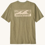 Patagonia men's boardshort responsibili tee in light green. Shows a cream wave brand logo on the upper back