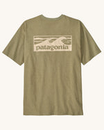 Patagonia men's boardshort responsibili tee in light green. Shows a cream wave brand logo on the upper back