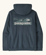 Patagonia men's boardshort logo uprisal hoody in summit blue. A thick hooded pull over with a large brand patch in a wave design on upper back