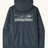 Patagonia men's boardshort logo uprisal hoody in summit blue. A thick hooded pull over with a large brand patch in a wave design on upper back