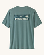 Patagonia men's capilene cool daily short sleeve t-shirt in sage blue with wave logo graphic on upper back