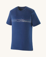 Patagonia men's capilene cool merino blend short sleeve t-shirt in blue with mountain graphic along the upper front body