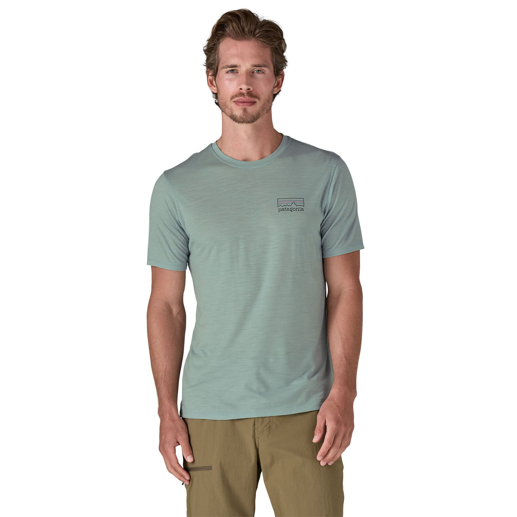 A man wearing The Patagonia Men's Capilene Cool Merino Graphic T-Shirt in thermal blue