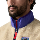 A close up of the Patagonia mens classic retro x fleece vest available at Babipur showing the royal blue turn up collar detail